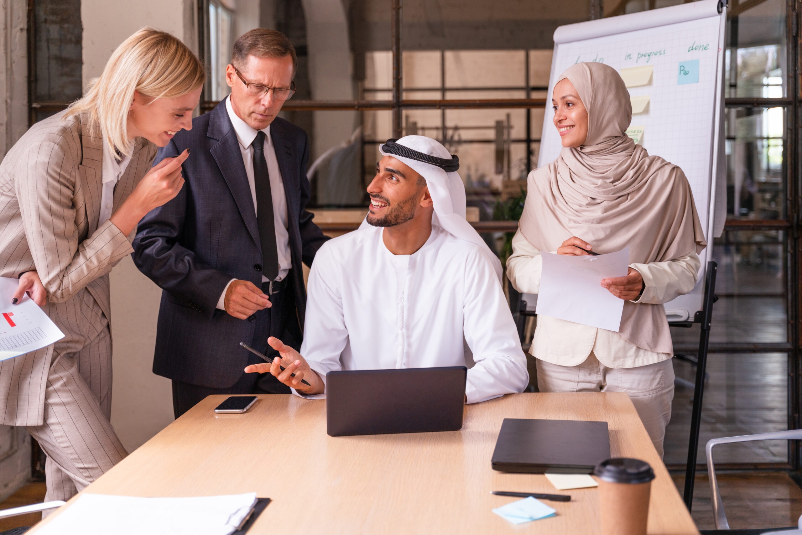 Multiethnic corporate business team meeting in the office for a strategic marketing plan - Office workers, entrepreneurs and company employee at work in a multinational company